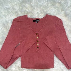 pink cropped fitted long sleeve shirt